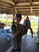 Evan Holds a Gator